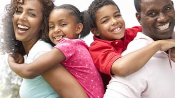 African-American Family of 4 all smiling